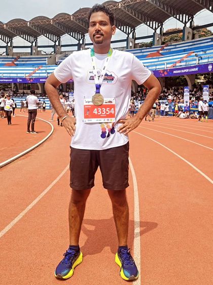 Standing tall after conquering 42.2 kilometers. This is a testament to the dedication and spirit of our runners. We celebrate every single finisher like the champion they are.