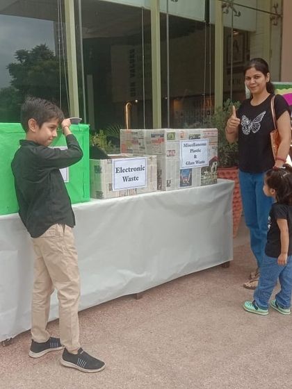 A family with young children learns about responsible disposal at our collection booth. It's never too early to teach the importance of recycling e-waste and other items correctly.