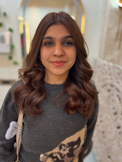 A beautiful copper mocha brown colour. This image shows the client's happy face, clearly thrilled with her new warm and vibrant hair.