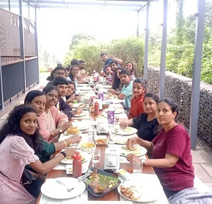 The whole group enjoying a delicious meal together during our Wayanad tour. Good food is a key part of the experience.