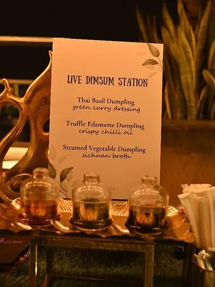 The setup for our live dimsum station, offering a variety of steamed dumplings like Thai Basil and Truffle Edamame, served with an array of flavourful dipping sauces.
