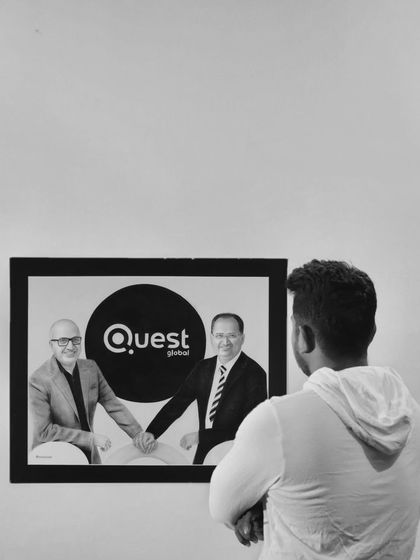 Me looking at the finished Quest Global corporate artwork. This piece, which took 54 hours, was a great honor to create.
