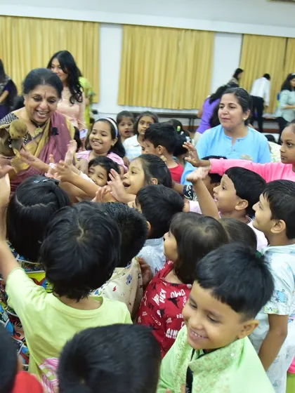 The purest joy is seeing a story reflected in a child's eyes. Here, surrounded by curious young minds at the Fravashi Academy, I am sharing a tale with a puppet friend. This is where the magic is most real, in these moments of shared wonder and laughter.