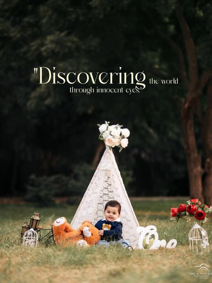Discovering the world through innocent eyes. A curious little boy and his teddy bear explore from their teepee during an outdoor session.