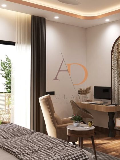 A wider view of the bedroom, showing the functional workspace nook and its seamless integration with the room's aesthetic and balcony access.