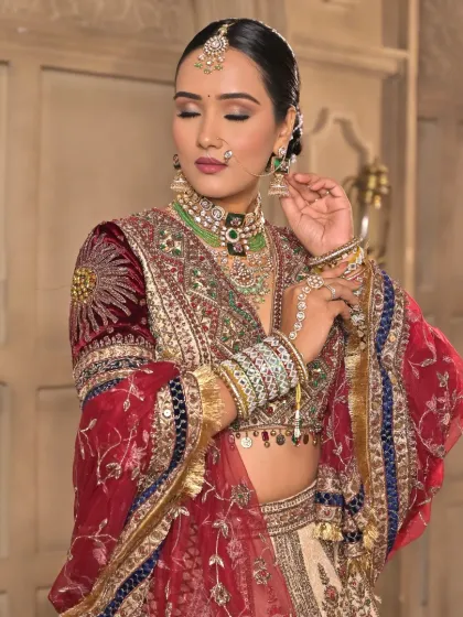 Another angle of this regal bridal look, showing the flawless base and the way the makeup complements the heavy, traditional jewelry without overpowering it.