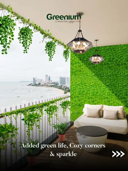 Even a high-rise balcony with a stunning view can be enhanced with the right greenery. Here, I used an artificial green wall and hanging creepers to create a cozy, green frame for the cityscape, making it the perfect urban escape.