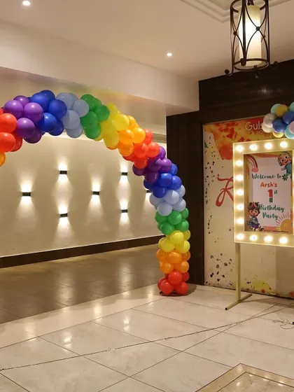 The entrance to Arsh's party featured a full rainbow-colored balloon arch, setting a vibrant tone from the start.