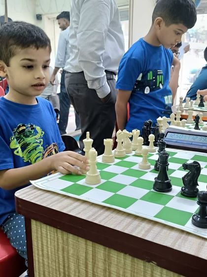 A young player carefully considers his next move. My chess program is designed to teach patience, foresight, and critical thinking from the very first lesson.