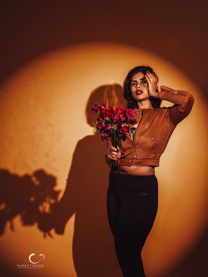 A clean and impactful version of the spotlight concept. The composition is minimalist, allowing the subject and her shadow to tell the story.