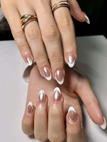 Another angle of these stunning chrome and white French tip nails. The high-shine chrome base paired with the crisp white tip is a perfect combination of classic and trendy.