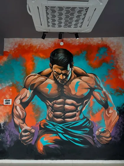 For businesses like gyms, the right visual can be a huge motivator. I painted this intense bodybuilder mural at Flexfire Premium Gym to create an atmosphere of power and determination. The vibrant colors and dynamic pose are designed to inspire everyone who walks in.