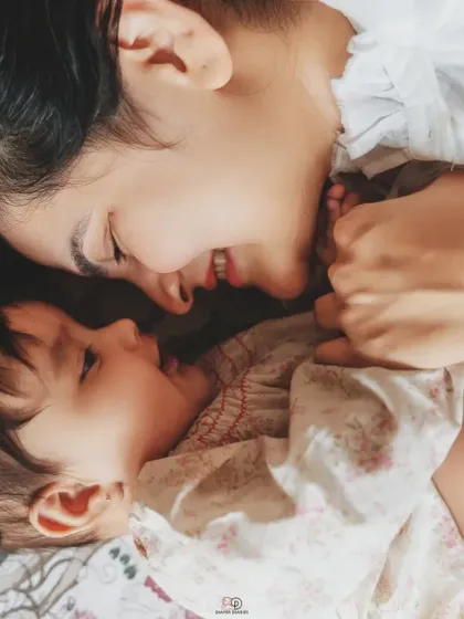 This is what a candid home session feels like. Just you and your baby, sharing a smile in the comfort of your own space, creating memories that are real and full of warmth.