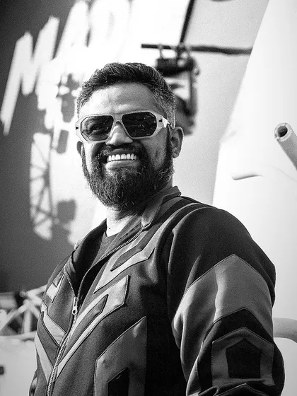 A happy, smiling black and white portrait from a Goa weekend. This captures the relaxed and joyful atmosphere of my beachside performances.