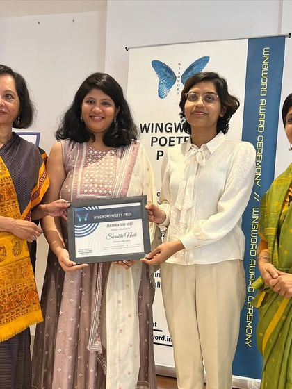 First prize winner Surabhi Naik is officially awarded her certificate.