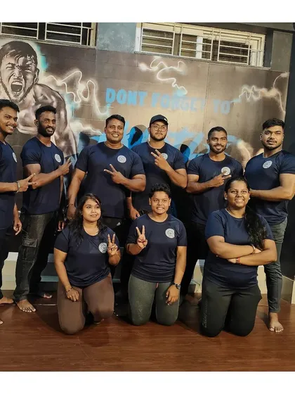 My team, my family. Here are my boys, ready to dominate at the National Powerlifting Championship. We train together, we compete together, and we win together.