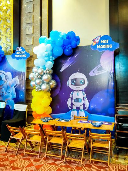 A "Mat Making" activity station set up at the space-themed party.