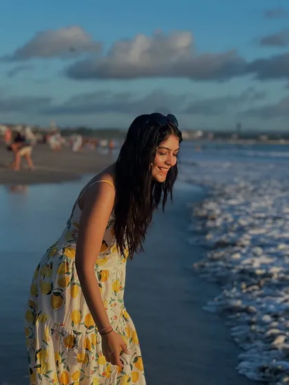 Enjoying the waves in Bali. The light fabric of this dress makes it ideal for walking along the shore.