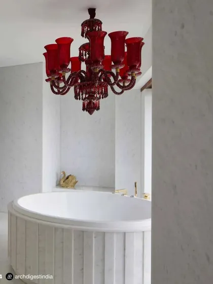 A repost from Architectural Digest showing the dramatic red chandelier in the master bathroom of the Bhanushali residence. This feature highlights how I use bold, unexpected elements to create luxurious and memorable spaces.
