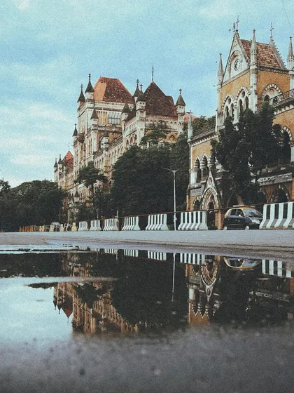 A puddle-reflection of the Bombay High Court and Rajabai Tower. The monsoon offers so many creative opportunities for architectural photography.