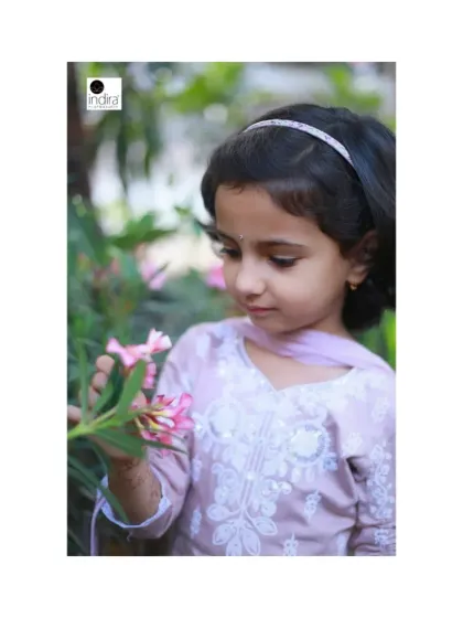 A quiet moment of curiosity during our outdoor shoot. This little girl was fascinated by the flowers, and I captured her gentle interaction with nature. These unposed, lifestyle portraits often tell the best stories.