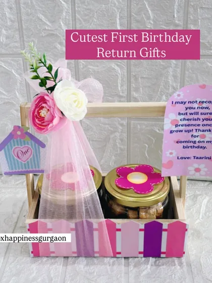 This "Cutest First Birthday Return Gifts" basket in pink is perfect for a little princess's party, featuring a sweet thank you note and floral accents.