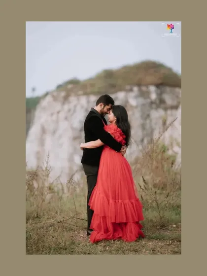 A fairytale moment captured against a raw, natural backdrop. The contrast between the elegant red gown and the rugged landscape creates a powerful, romantic image that feels both grand and intimate. This is the kind of cinematic storytelling I love to create.