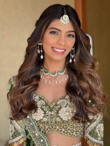 A close-up of her happy, glowing face. The makeup is fresh and minimal, proving that you don't need heavy layers to look absolutely stunning.