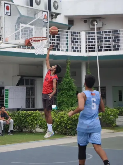 A player driving for a layup during the UPBA tryouts, demonstrating their finishing ability.