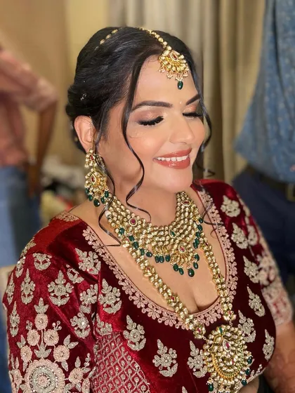 The joy of a bride seeing her final look. Nutisha's glowing skin and sparkling eyes were the highlights of her traditional wedding makeup.