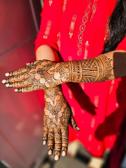 A creative pose showing both the front and back of the hands.