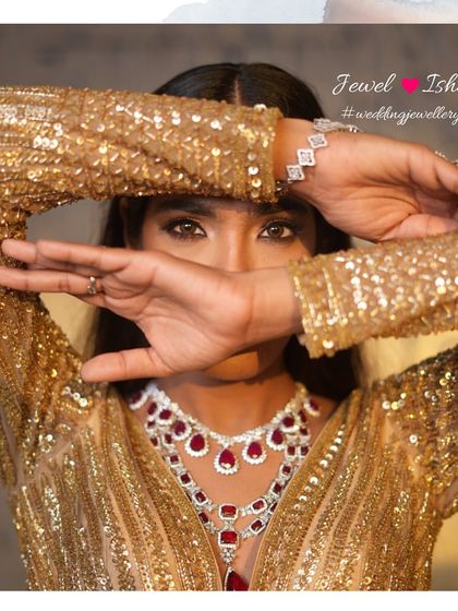 A touch of mystery and a lot of glam. The peek of the layered ruby and diamond necklace hints at the full splendor of the look. It’s about creating intrigue and showcasing your style.