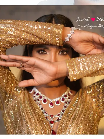 A touch of mystery and a lot of glam. The peek of the layered ruby and diamond necklace hints at the full splendor of the look. It’s about creating intrigue and showcasing your style.