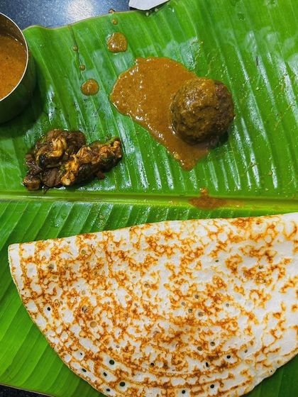 A delicious South Indian meal served on a banana leaf. We love to include authentic local food experiences in our tours and meetups.