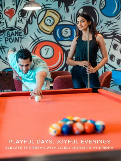 Beyond the tranquility, a world of playful energy awaits at Kridha. Challenge a friend to a game of pool amidst vibrant graffiti art, creating moments of fun and friendly competition during your stay.