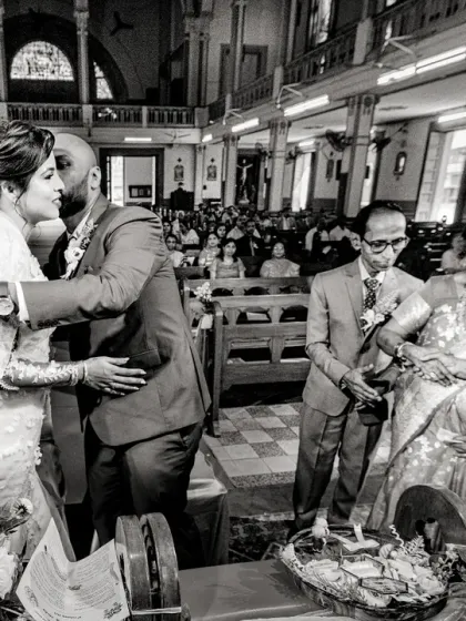 While the couple shares their first kiss, their parents congratulate each other in the background. This is what I call "multi-layering moments," a key part of my documentary style.