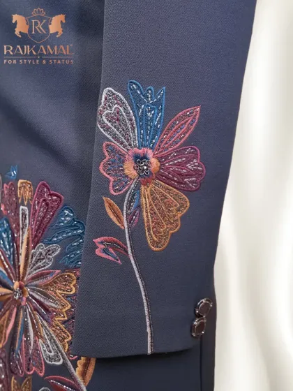 This image highlights the intricate, multi-colored floral embroidery on the sleeve of a Jodhpuri jacket. It’s a perfect example of how I blend desi roots with global trends.