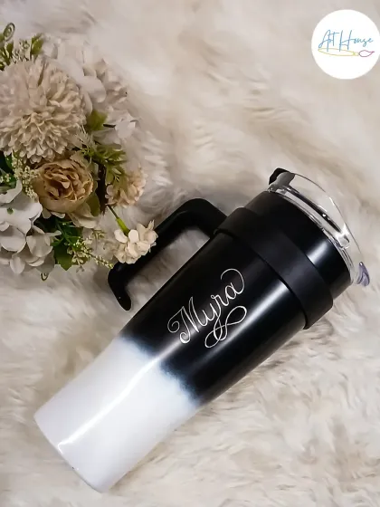This custom engraved tumbler is one of my most popular requests. The elegant script of the name 'Myra' on this modern black and white sipper makes it a stylish and personal accessory for your daily hydration.