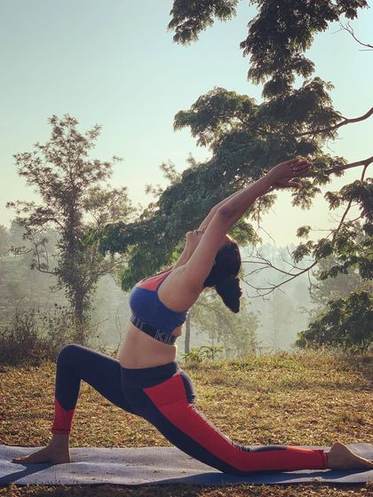 Anjaneyasana, or Crescent Moon Pose, provides a deep stretch for the hip flexors and quadriceps. It is a key pose for improving flexibility for daily life and for more advanced postures.