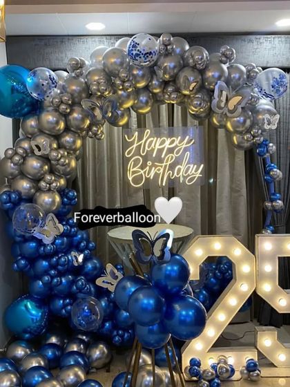 Another angle of the glamorous blue and silver 25th birthday decor.