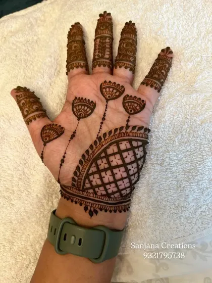 This unique design features a semi-circular net pattern with hanging lotus motifs, a perfect example of Indo-Western fusion.