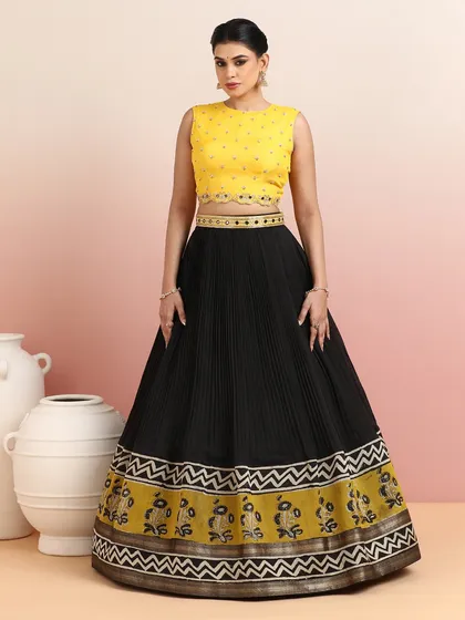 As one of our festive bestsellers, this black and yellow lehenga is a perfect example of timeless design with a contemporary twist.
