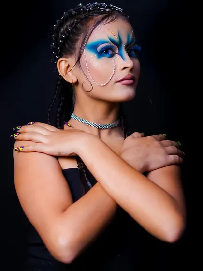 The combination of the edgy hair, bold makeup, and unique accessories creates a truly memorable character.