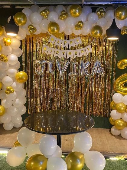 Another view of the elegant gold and white decor, perfect for a toddler's birthday.