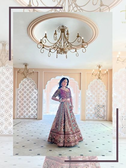 This wide shot captures the grandeur of the bridal lehenga in a palace-like setting, showing how it creates a truly royal look.