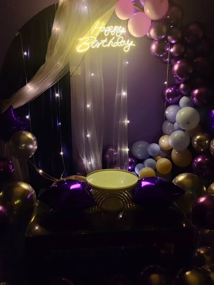 A slightly different angle of the elegant birthday setup, showing the cake stand centered and ready for the celebration.