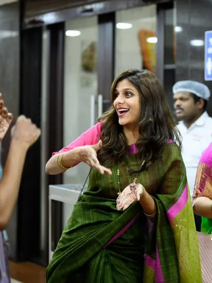 More dancing and fun with the bride's friends. Their expressions are full of life and uninhibited joy.