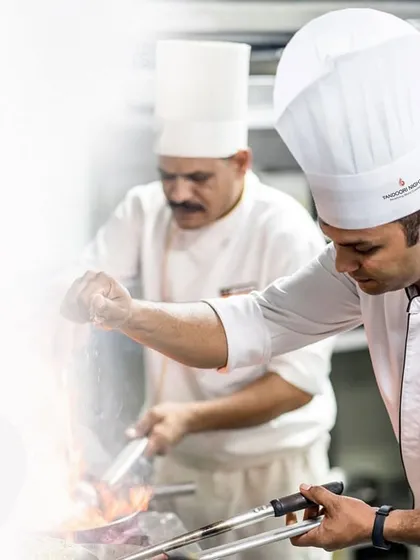 In the heart of the kitchen, our chefs masterfully work the flames. This is where the magic begins, combining fresh ingredients and expert techniques to create the signature flavors of Tandoori Nights.