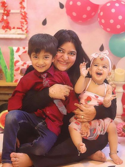 The whole family joins in for the "One in a Melon" first birthday fun! Capturing these moments with parents and siblings makes the celebration even more memorable.