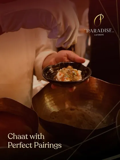 Our live chaat station in action. A chef prepares a custom plate of chaat, combining tangy, spicy, and sweet flavors to the guest's liking.